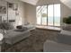 Bright living room with a vaulted ceiling and large glass doors leading to a balcony at 532 Lombardi Cir, Louisville, CO 80027