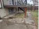 A view of backyard featuring a deck with stairs, and a concrete area for outdoor enjoyment at 220 Mckinley Dr, Bennett, CO 80102