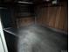 Spacious garage area featuring a workbench and ample storage, perfect for projects and organization at 220 Mckinley Dr, Bennett, CO 80102