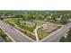 Community park featuring a playground, gardens, and baseball field with sidewalks bordering the paved roads at 9300 E Florida Ave # 1202, Denver, CO 80247