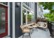 Charming balcony with outdoor seating, a metal railing, and views of neighborhood trees at 9300 E Florida Ave # 1202, Denver, CO 80247
