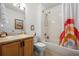 Well-maintained bathroom with a shower-tub combo and a vanity at 9300 E Florida Ave # 1202, Denver, CO 80247