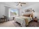 Stylish bedroom with ample sunlight, decor, and a ceiling fan at 9300 E Florida Ave # 1202, Denver, CO 80247