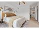 Bedroom featuring a light wood bedframe and neutral toned decor at 9300 E Florida Ave # 1202, Denver, CO 80247