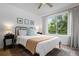 Inviting bedroom with a large window, creating a bright and peaceful atmosphere at 9300 E Florida Ave # 1202, Denver, CO 80247