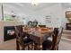 Dining area with a decorative gallery wall, fireplace views, and comfortable seating at 9300 E Florida Ave # 1202, Denver, CO 80247