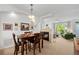 The open-concept dining area features a fireplace and flows into the living room at 9300 E Florida Ave # 1202, Denver, CO 80247