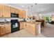 Bright kitchen featuring stainless steel appliances, pendant lighting, and an island at 9300 E Florida Ave # 1202, Denver, CO 80247