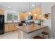 Modern kitchen with stainless steel appliances and a breakfast bar with seating at 9300 E Florida Ave # 1202, Denver, CO 80247