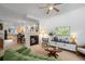 Open-concept living room featuring a fireplace and view to kitchen and dining areas at 9300 E Florida Ave # 1202, Denver, CO 80247