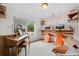 Stylish home office featuring a piano, built-in desk, and a view to the outside at 9300 E Florida Ave # 1202, Denver, CO 80247