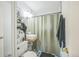 Stylish bathroom with subway tile, a unique vessel sink, and a modern shower curtain for a contemporary touch at 3080 N Cook St, Denver, CO 80205