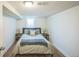 Cozy basement bedroom featuring a full bed, hardwood floors and neutral colors, perfect for relaxation at 3080 N Cook St, Denver, CO 80205