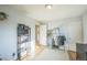 Bright bedroom featuring hardwood floors, ample storage, a clothing rack, and neutral decor at 3080 N Cook St, Denver, CO 80205