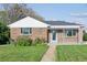 Charming single-story brick home with a well-manicured lawn and cozy covered porch at 3080 N Cook St, Denver, CO 80205