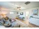 Spacious living room featuring a large sectional sofa, hardwood floors, and modern decor at 3080 N Cook St, Denver, CO 80205