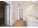 Bathroom featuring a double sink vanity, framed mirror, and a glass enclosed shower stall at 45927 Wood Thrush Ave, Bennett, CO 80102