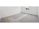 Bright bedroom with large windows, neutral walls, and new gray carpet at 45927 Wood Thrush Ave, Bennett, CO 80102