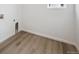 Cozy laundry room with new flooring and hook ups ready for a washer and dryer at 45927 Wood Thrush Ave, Bennett, CO 80102