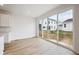 Bright living space features large sliding glass doors to the backyard and modern flooring at 45927 Wood Thrush Ave, Bennett, CO 80102