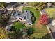 Aerial view of house showcasing solar panels, lush landscaping, and colorful foliage at 34 Skyline Dr, Wheat Ridge, CO 80215