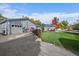 Lovely backyard featuring an expansive lawn, patio and beautiful landscaping at 34 Skyline Dr, Wheat Ridge, CO 80215