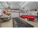 Spacious two car garage with shelves and ample room for working on projects at 34 Skyline Dr, Wheat Ridge, CO 80215