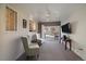 Bright living room with two chairs, slider door and backyard view at 34 Skyline Dr, Wheat Ridge, CO 80215