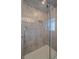 Modern bathroom with glass enclosed shower and tile surround, offering a luxurious spa-like experience at 34 Skyline Dr, Wheat Ridge, CO 80215