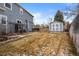 Backyard featuring a small shed, a fenced in garden, and partial grass coverage at 5604 S Shawnee St, Aurora, CO 80015