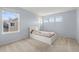 Bedroom featuring a platform bed, and a large picture window offering natural light at 5604 S Shawnee St, Aurora, CO 80015