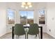 Bright breakfast nook with ample natural light and views of the backyard at 5604 S Shawnee St, Aurora, CO 80015