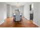 Elegant dining room with a chandelier, large window, and stylish decor at 5604 S Shawnee St, Aurora, CO 80015