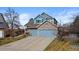 Charming two-story home featuring stone accents, blue siding, and a spacious two-car garage, plus additional single car garage at 5604 S Shawnee St, Aurora, CO 80015