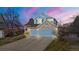 Beautiful two-story home with a stone and blue facade and a three-car garage at 5604 S Shawnee St, Aurora, CO 80015