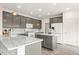 Bright kitchen with granite countertops, center island, and modern appliances at 5604 S Shawnee St, Aurora, CO 80015