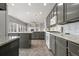 Modern kitchen featuring granite countertops, stainless steel appliances, and tile backsplash at 5604 S Shawnee St, Aurora, CO 80015
