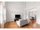 Bright and airy living room featuring hardwood floors and a soaring ceiling at 5604 S Shawnee St, Aurora, CO 80015