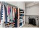 Walk-in closet featuring custom shelving and clothing racks for optimal organization at 5604 S Shawnee St, Aurora, CO 80015