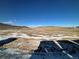 Panoramic view of open space, distant mountains and neighborhood at 3104 S Russell St, Morrison, CO 80465