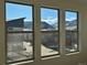 Stunning mountain and neighborhood views from large windows at 3104 S Russell St, Morrison, CO 80465