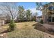 Expansive backyard featuring mature trees, a spacious lawn, and an inviting patio area at 7356 S Miller Ct, Littleton, CO 80127