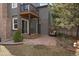 Cozy backyard deck with seating and stone pavers, providing a relaxing outdoor space at 7356 S Miller Ct, Littleton, CO 80127