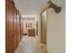 Hallway with storage closet and access to bathroom and bedroom at 7356 S Miller Ct, Littleton, CO 80127