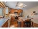 Charming kitchen with a farmhouse sink, a kitchen island and stainless steel appliances at 7356 S Miller Ct, Littleton, CO 80127