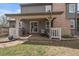 Spacious patio featuring a grill, outdoor seating, and access to the home via sliding glass doors at 7356 S Miller Ct, Littleton, CO 80127