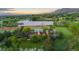 Stunning aerial view of estate, nestled on sprawling grounds with a private lake and mountain backdrop at 700 Utica Ave, Boulder, CO 80304