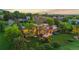 Aerial view of an estate surrounded by mature trees, manicured gardens, and ample privacy at 700 Utica Ave, Boulder, CO 80304