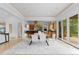 Modern dining area leads into the open kitchen and features access to a patio for seamless indoor/outdoor dining at 700 Utica Ave, Boulder, CO 80304