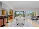 Bright dining room with modern table, chairs, and sliding glass doors to the outdoor space at 700 Utica Ave, Boulder, CO 80304